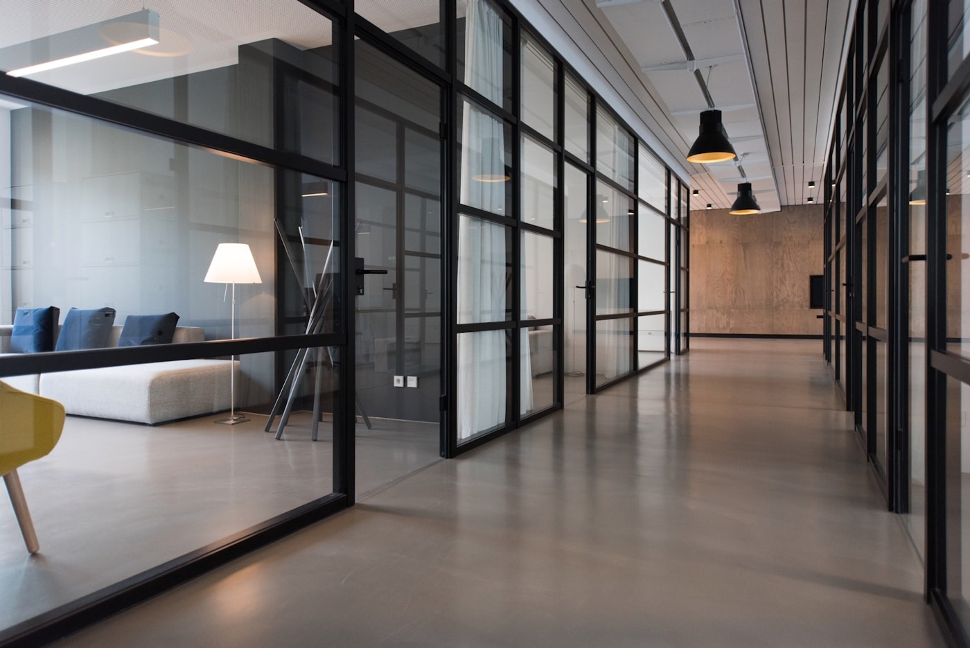 Modern business office workspace with glass meeting rooms